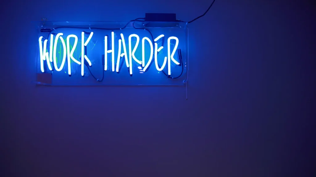 Photo of a sign that says work harder